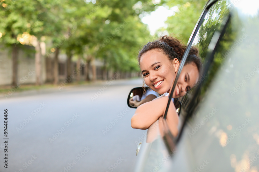 African-American female driver in car