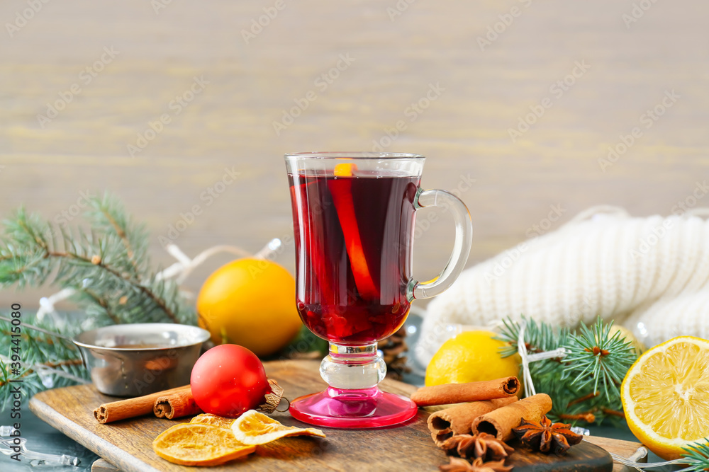 Glass cup of tasty mulled wine on table