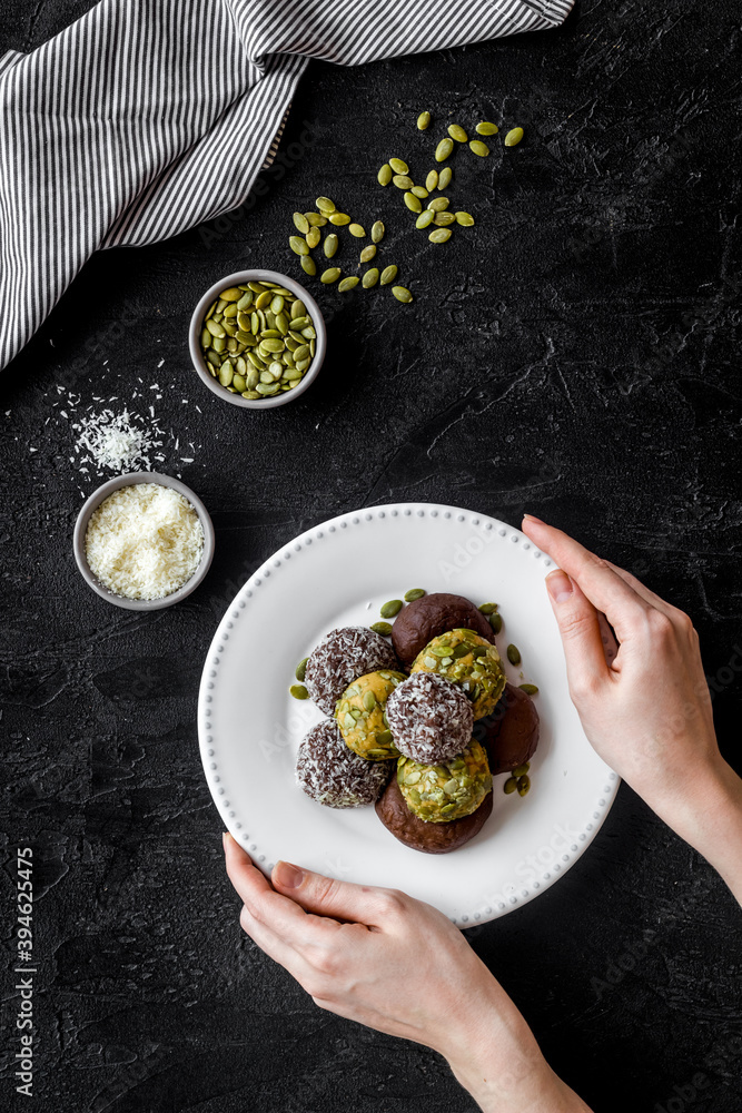 Homemade raw chocolate balls - vegan truffles with cacao and coconut