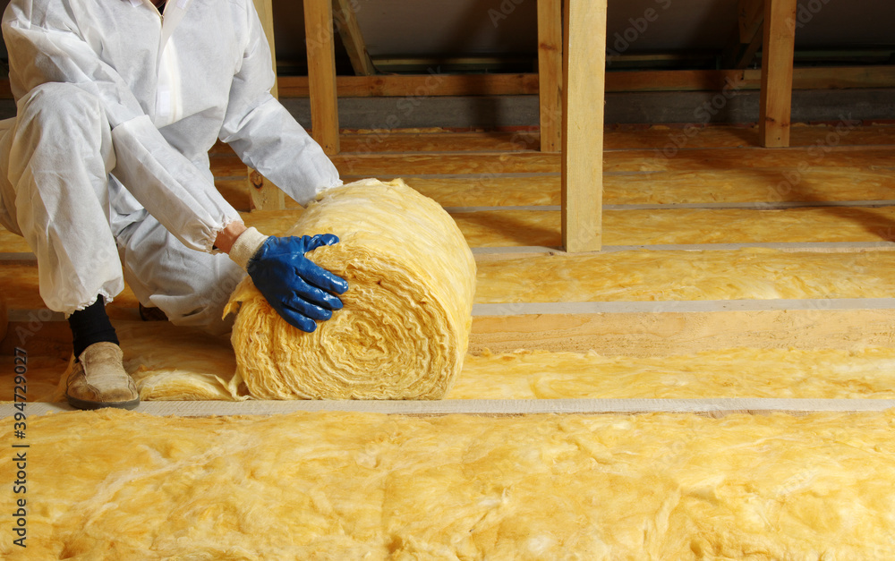 Man installing thermal roof insulation