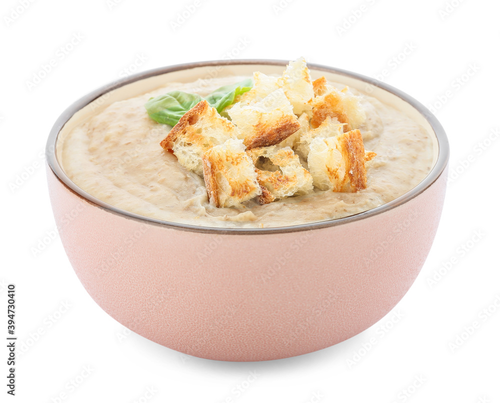 Bowl of tasty cream soup on white background