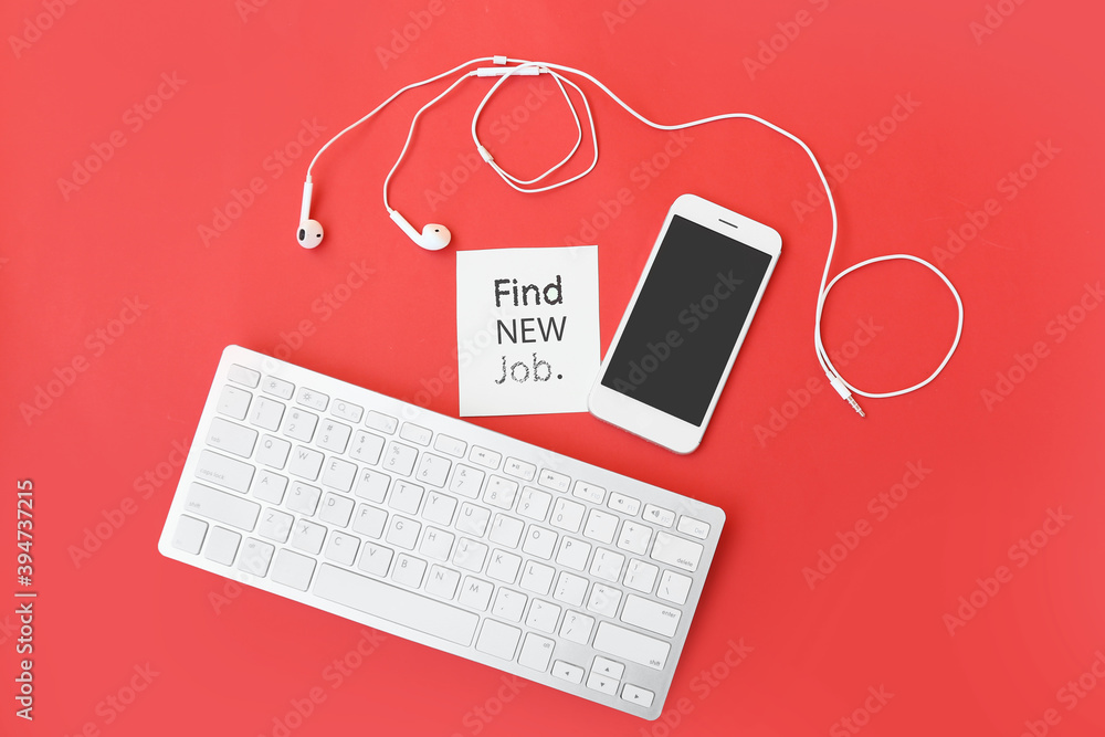 Computer keyboard with mobile phone and paper sheet with text FIND NEW JOB on color background