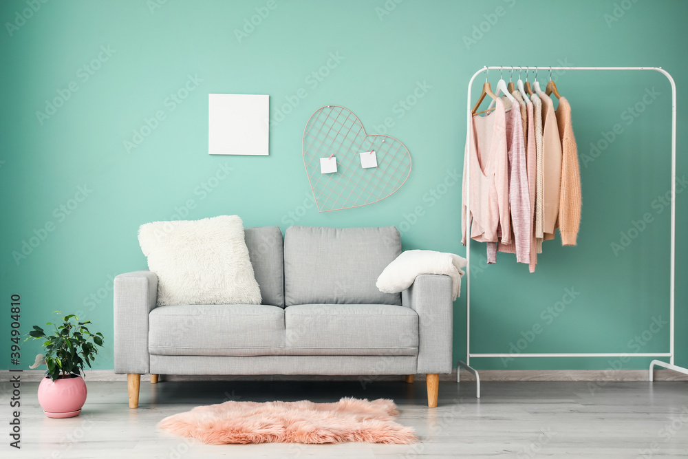 Stylish sofa in interior of living room