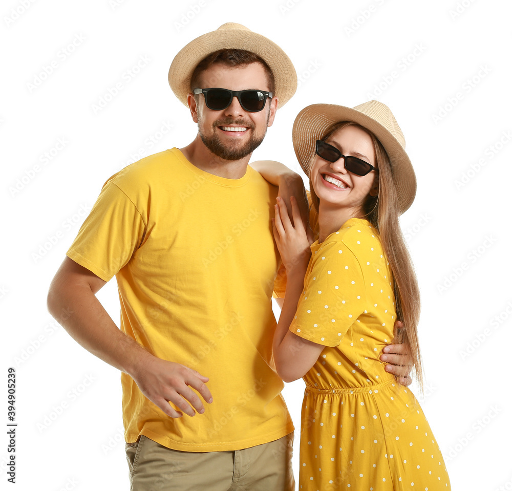 Young couple with stylish sunglasses on white background