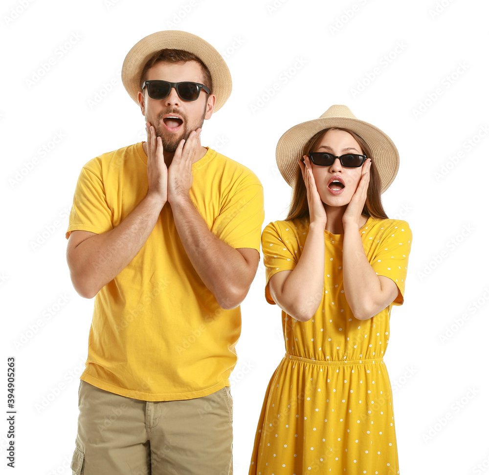 Surprised couple with stylish sunglasses on white background