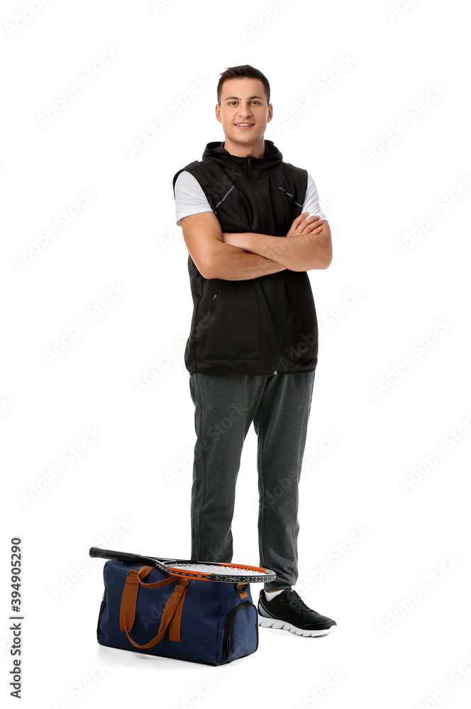 Sporty young man with bag on white background