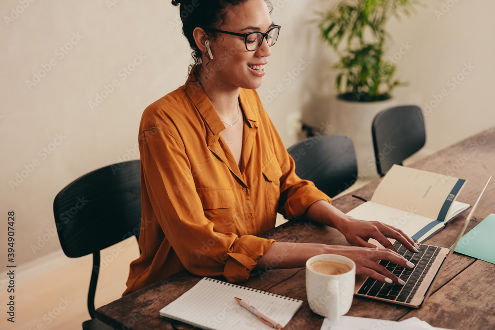 Business woman working on laptop at home office