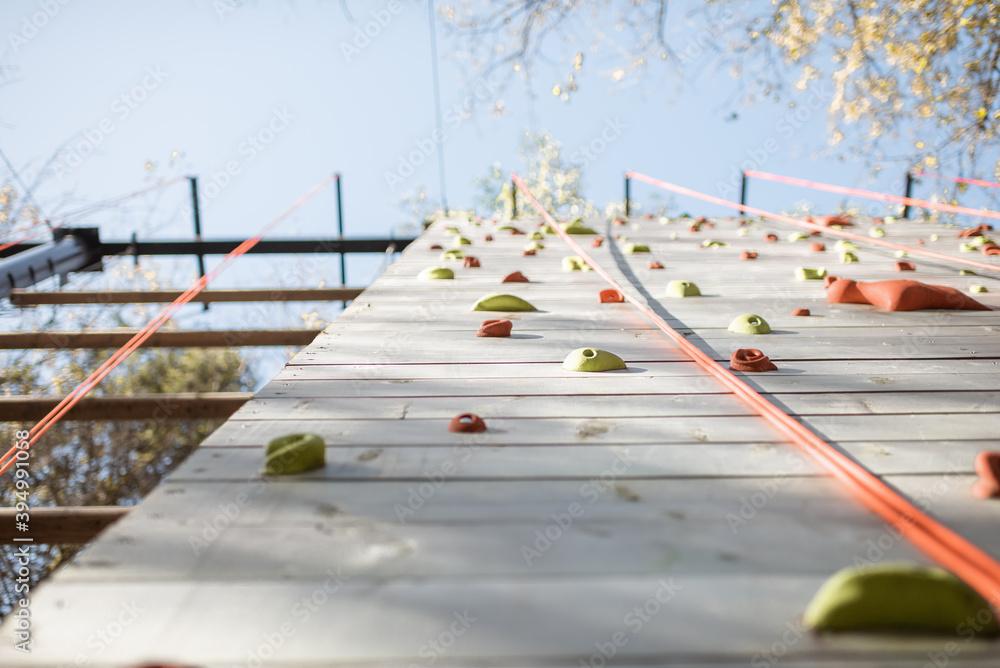 Artificial climbing wall at amusement park outdoors