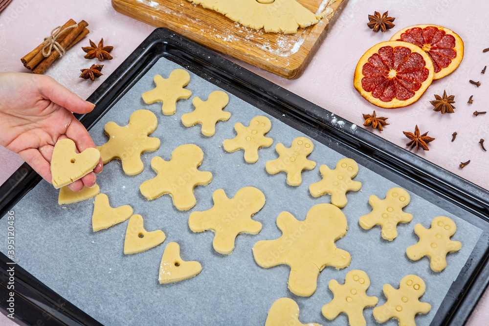 Christmas traditional bakery. Family cooking process making gingerbread and hearts cookies. Cookies 