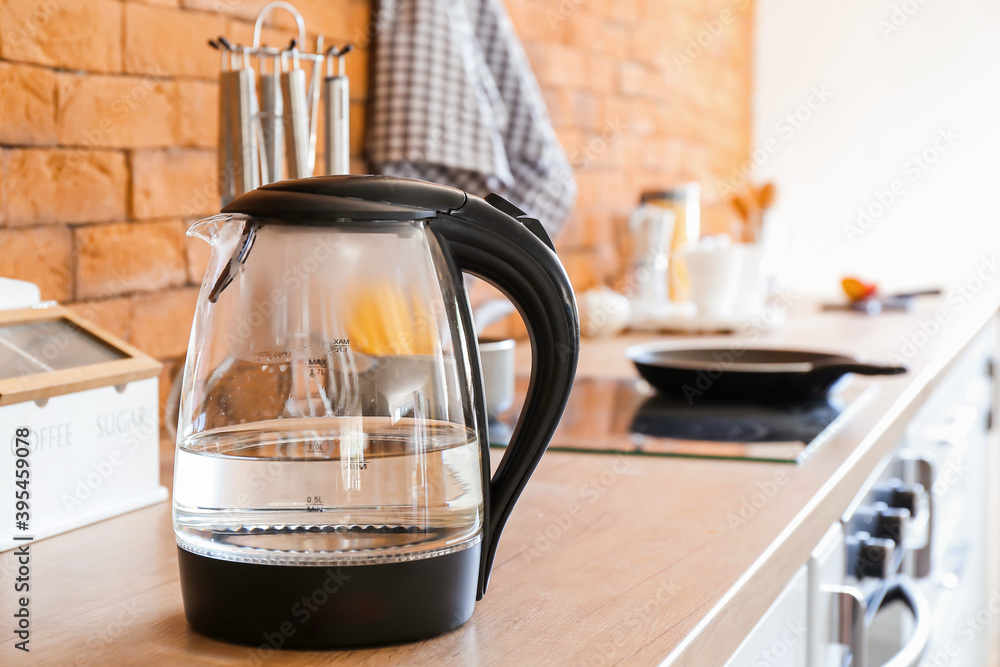 Electric kettle with water in kitchen