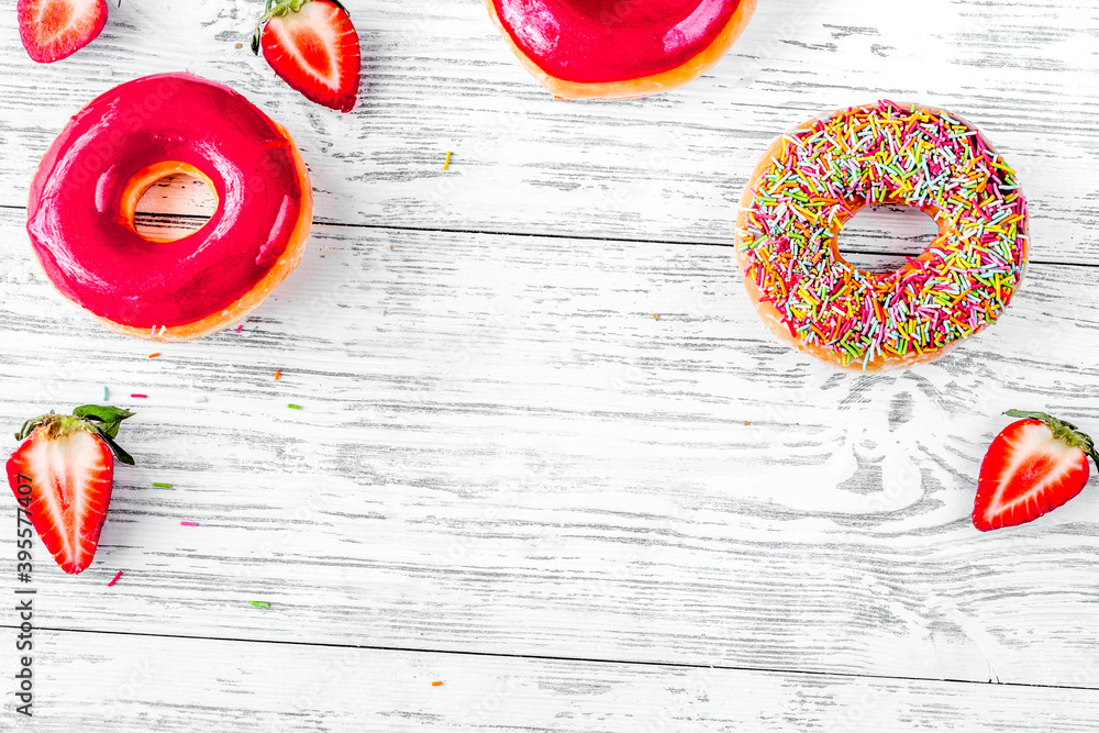 lunch with donuts and strawberry on wooden table background top view mock up