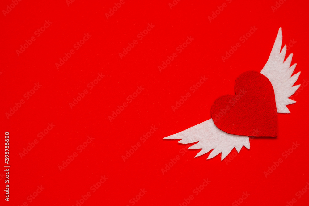 Valentines day. Red heart with white angel wings