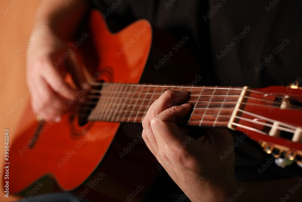 Man playing an acoustic guitar