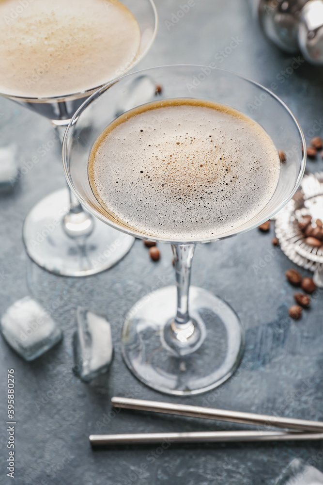 Glasses of tasty espresso martini cocktail on table