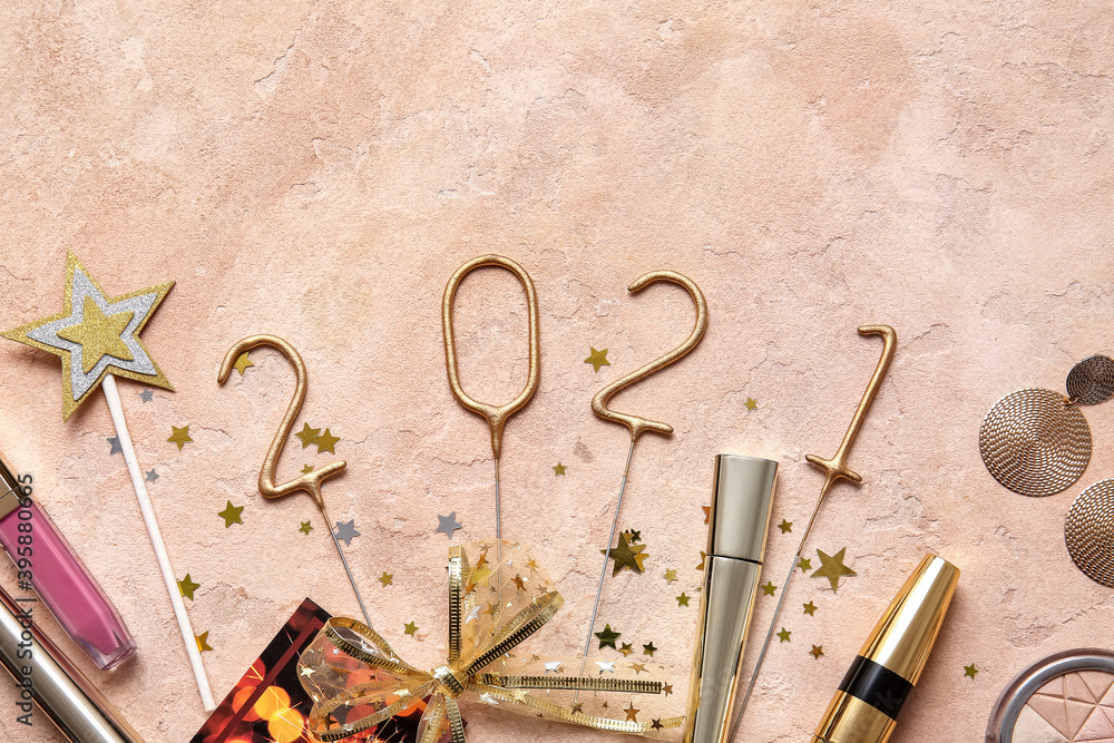 New Year composition with makeup cosmetics on color background