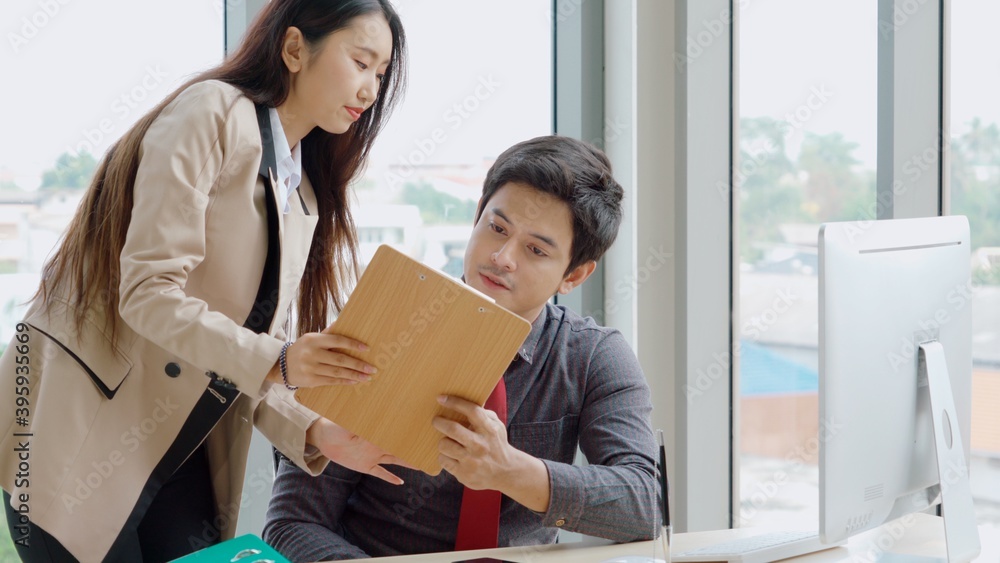 Two business people talk project strategy at office meeting room. Businessman discuss project planni