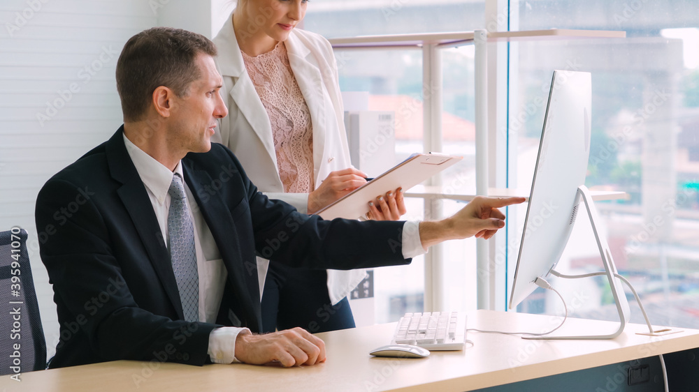 Two business people talk project strategy at office meeting room. Businessman discuss project planni