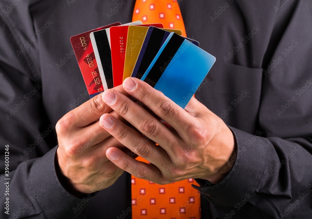 Closeup of a Businessman Showing Credit Cards