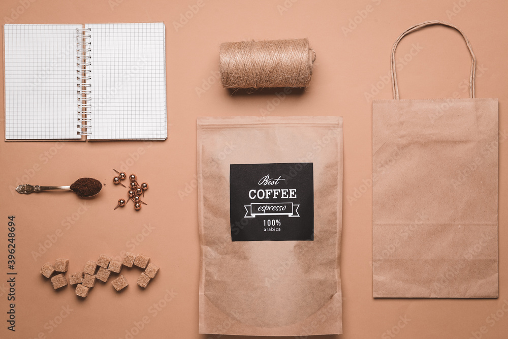 Composition with pack of coffee on color background