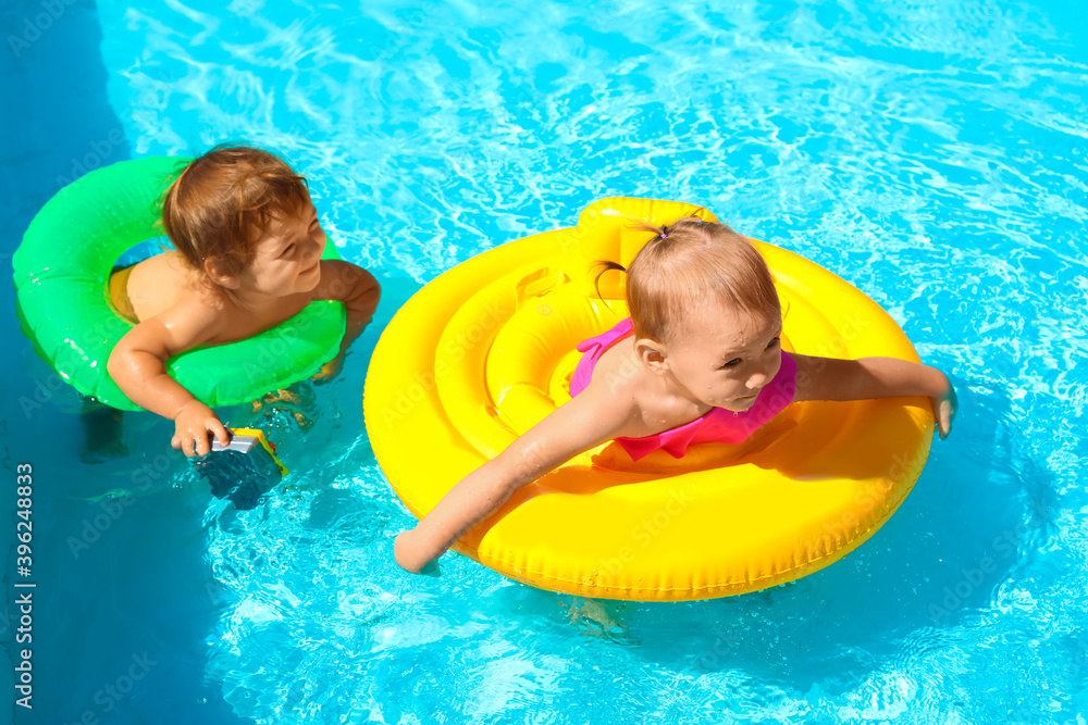 Cute little children in swimming pool