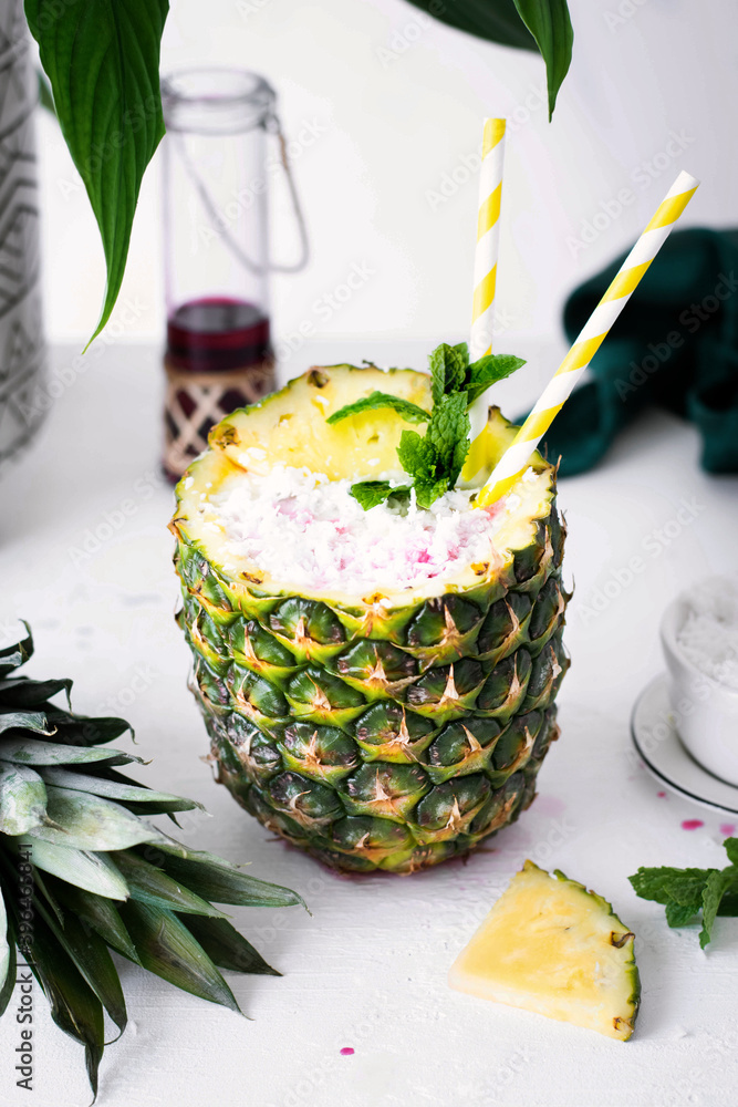 Fresh pineapple drink with coconut cranberry syrup