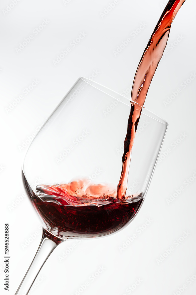 Red wine pouring into a wine glass