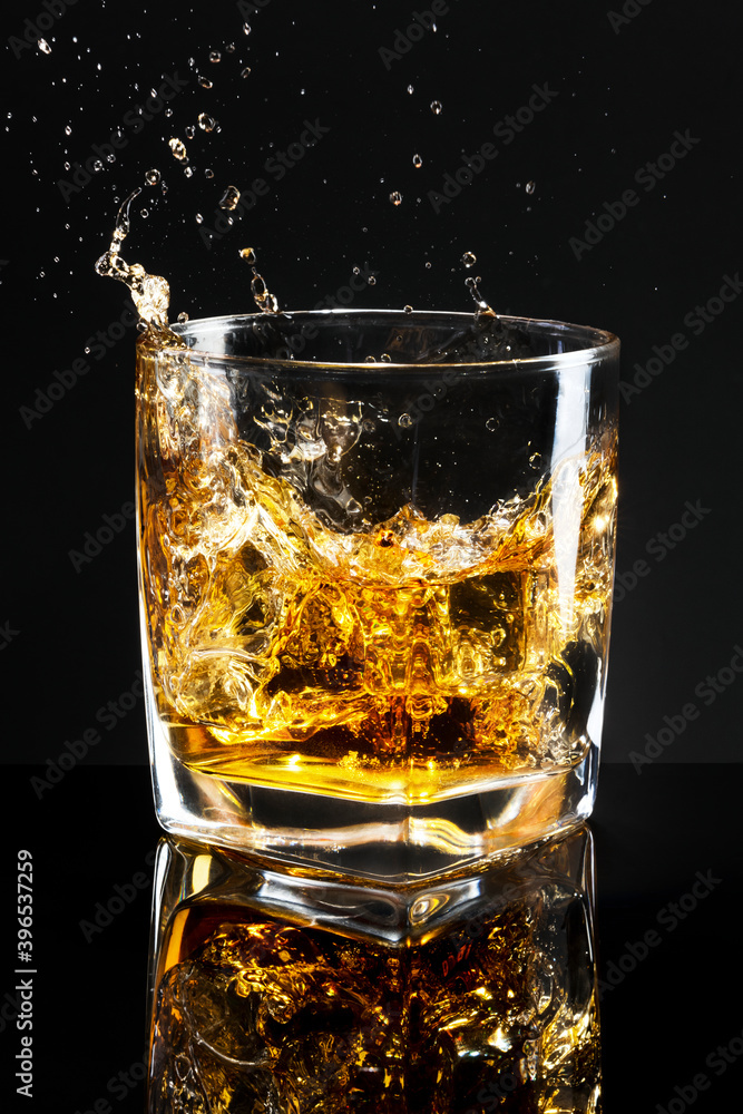 Whiskey on the rocks black background