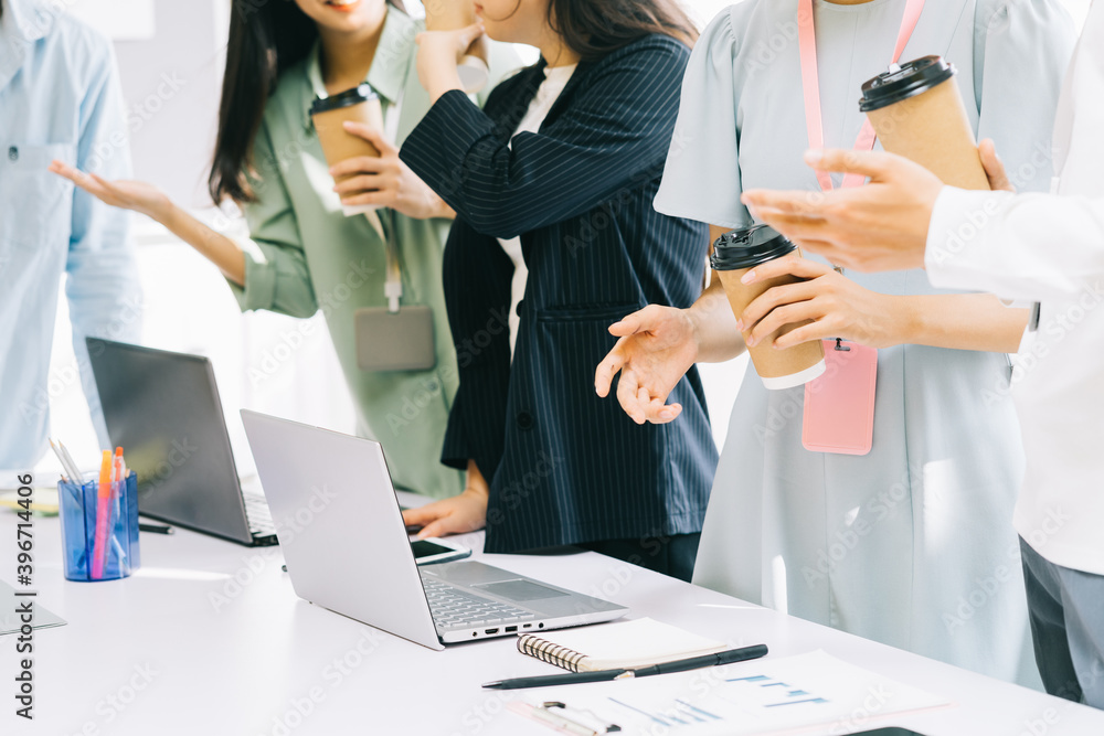 Business people are standing together for a break