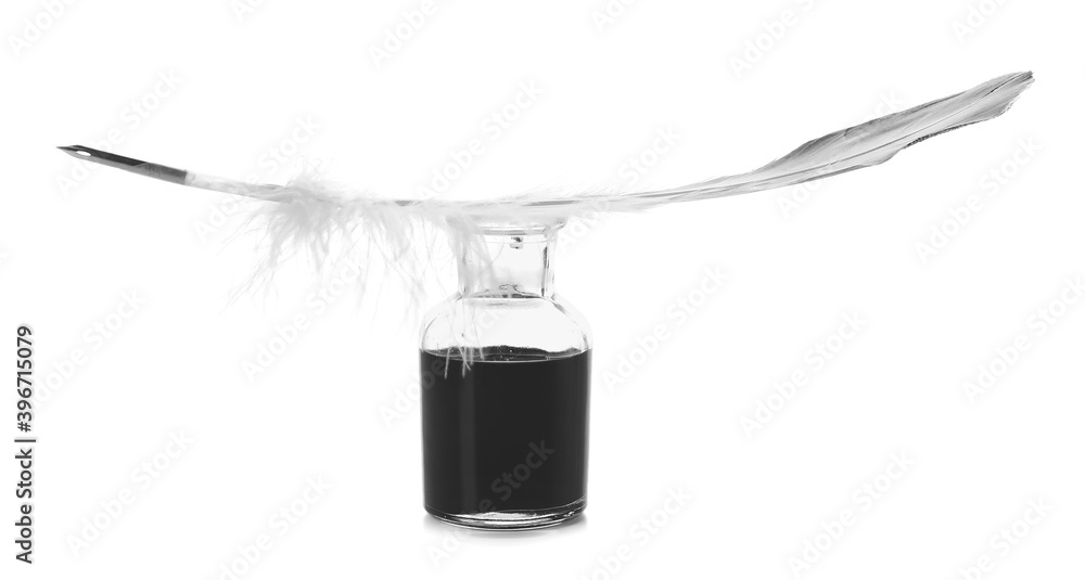 Feather pen and inkwell on white background