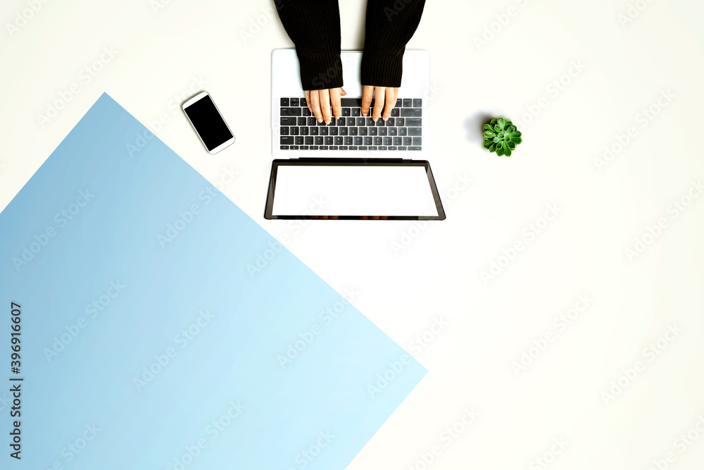 Person using a laptop computer from above