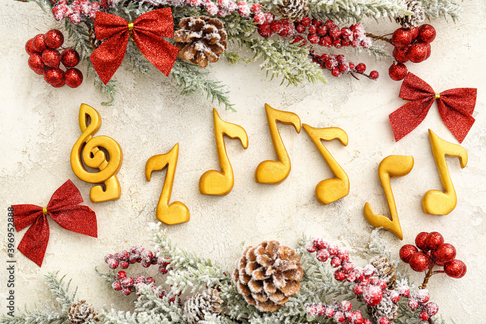 Note signs and Christmas decor on light background