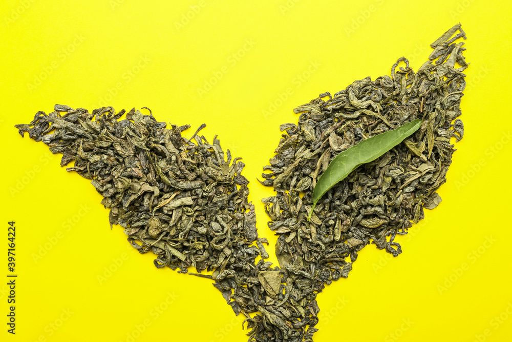 Dry green tea on color background