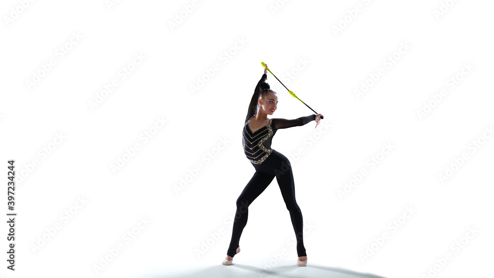 Rhythmic gymnast isoladed on white.