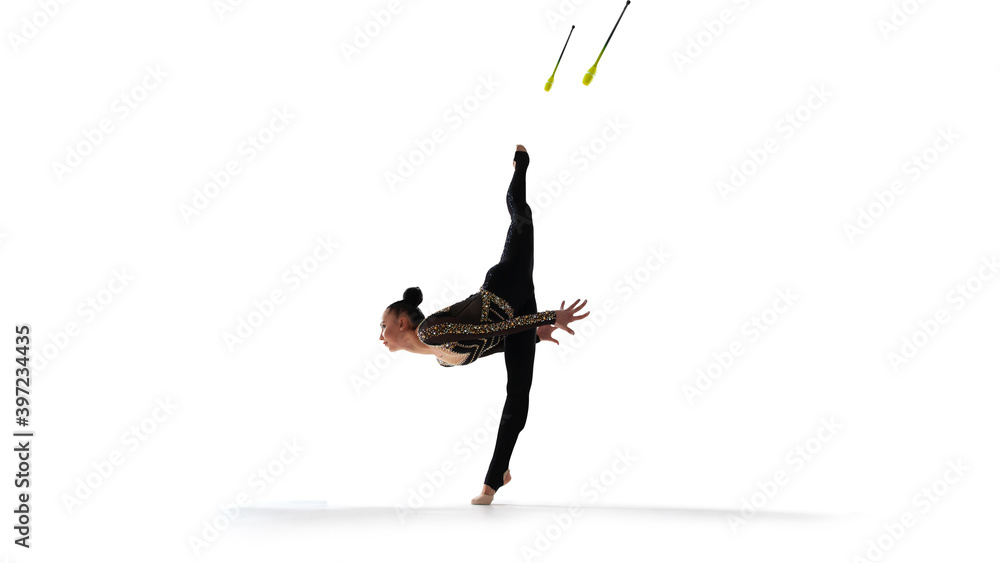 Rhythmic gymnast isoladed on white.