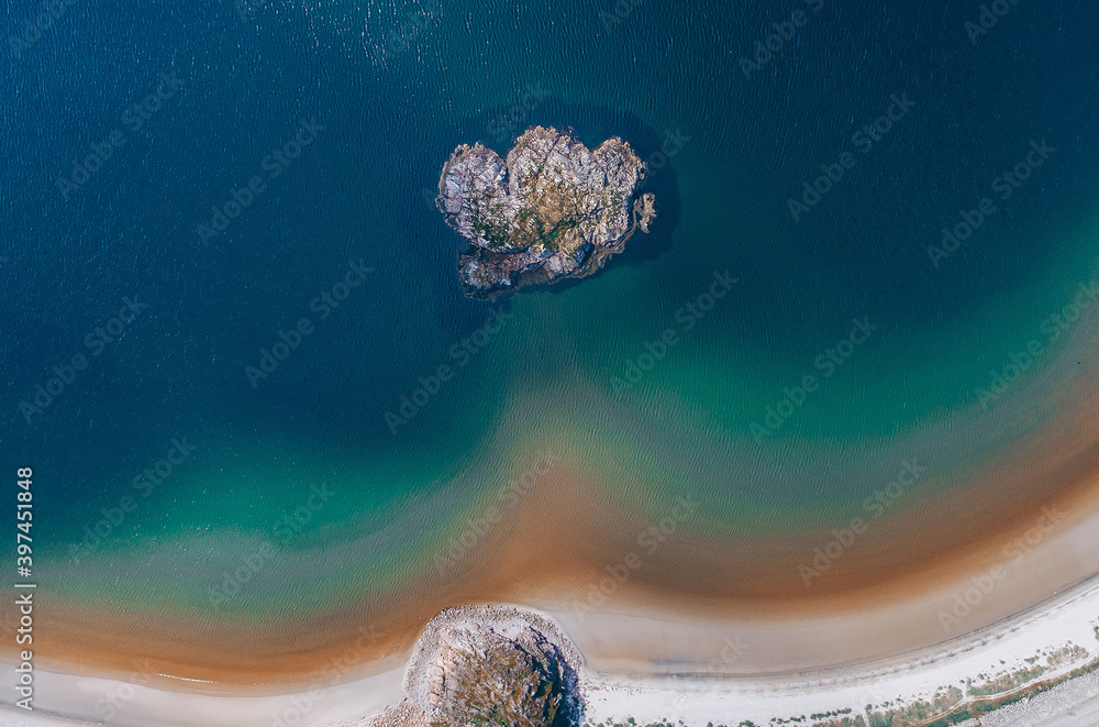 Aerial view of turquoise clear water Arctic ocean coast line in village Teriberka.