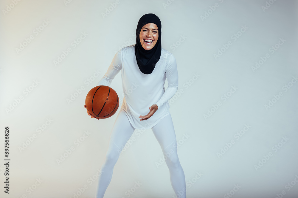 Cheerful basketball athlete on white background