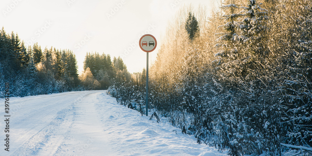 Winter road through the forest	
