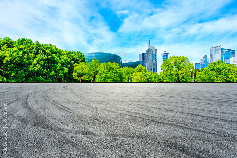 Empty asphalt road and financial district buildings in Shanghai,China.