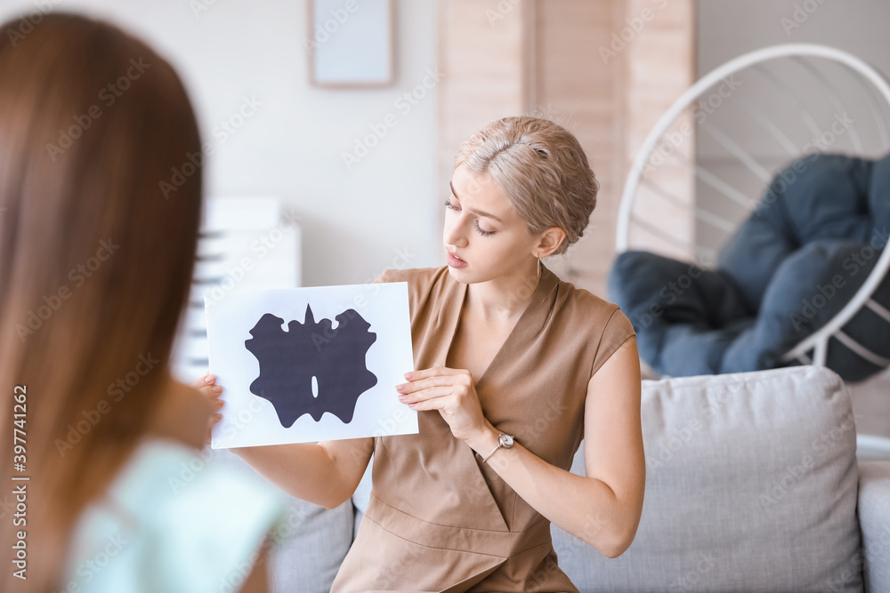 Psychologist working with young couple in office