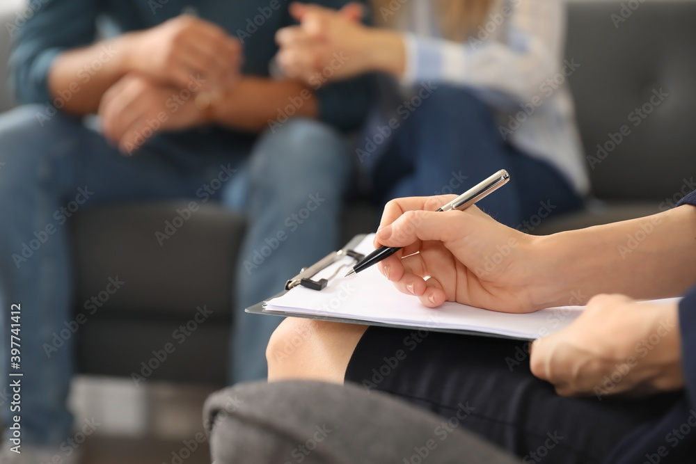 Psychologist working with young couple in office, closeup