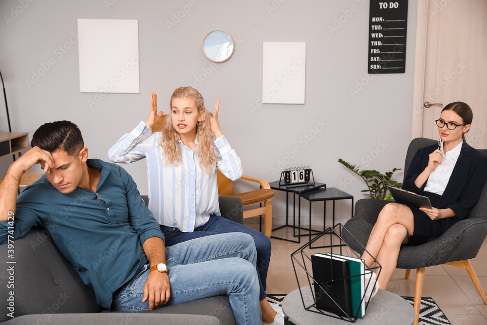 Psychologist working with young couple in office