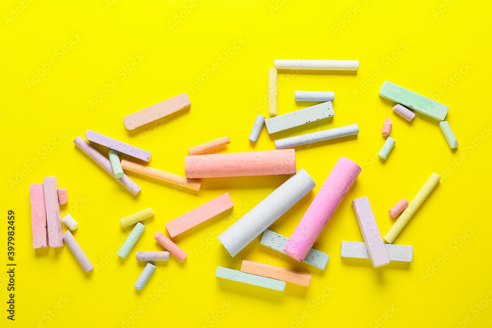 Colorful chalks on color background