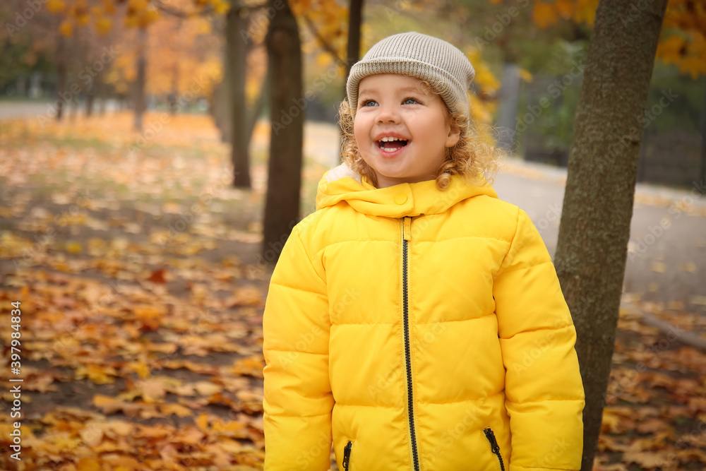 Cute little girl in autumn park