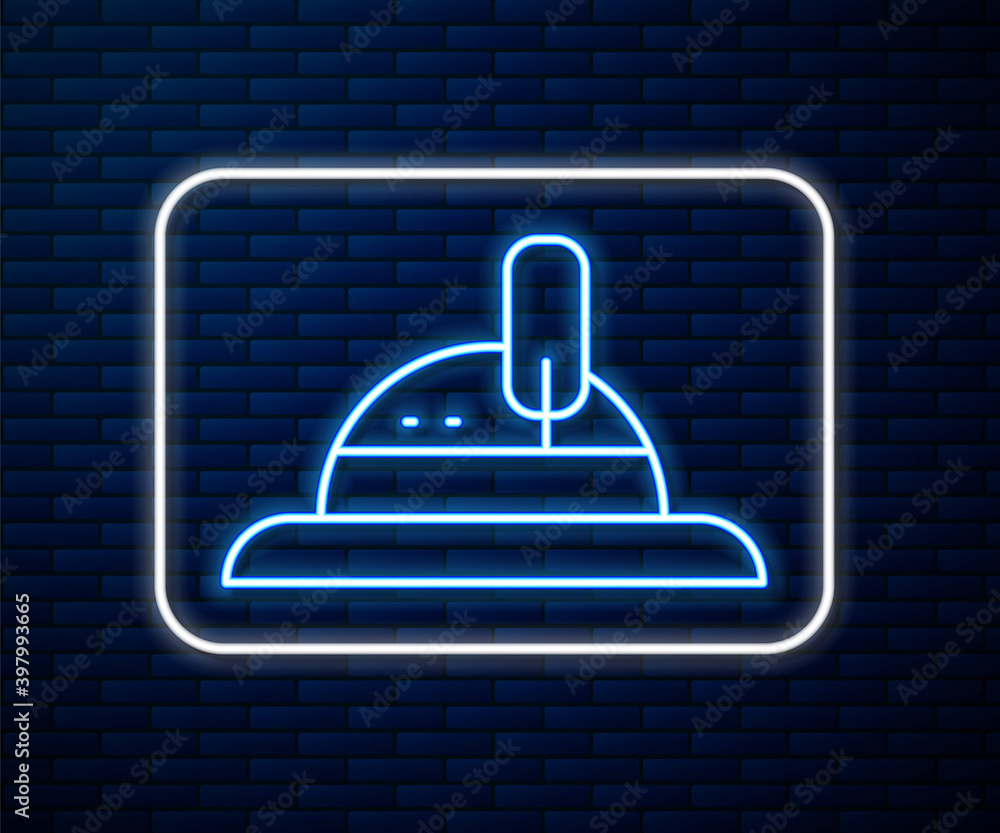 Glowing neon line Hunter hat icon isolated on brick wall background. Plaid winter hat. Vector.