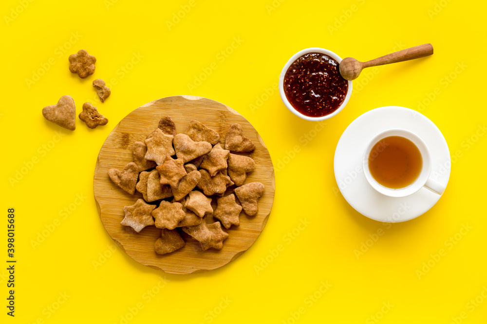 Freshly baked butter cookies with tea, top view