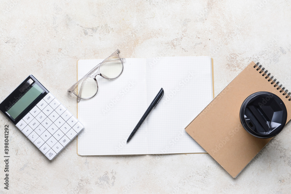 Notebook with pen on light background