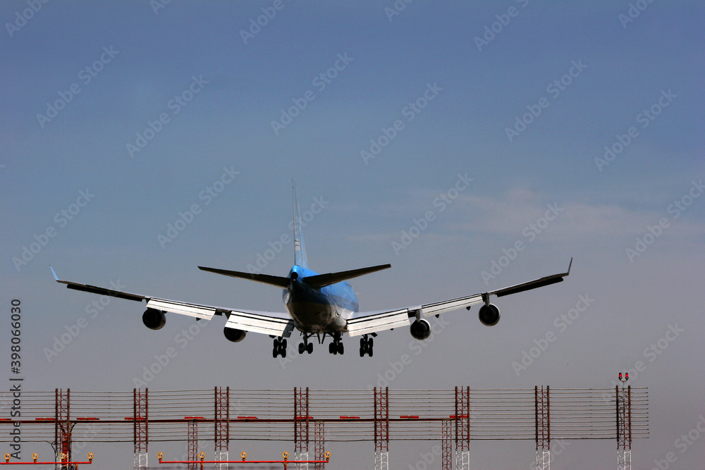 Passenger aircraft landing at close range.