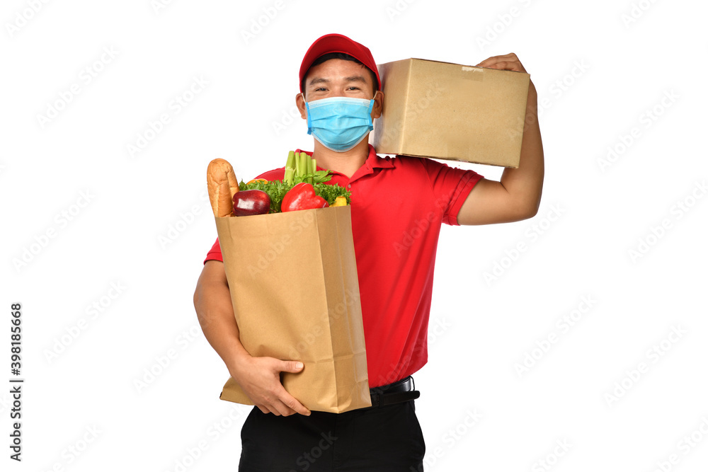  Asian delivery man in red uniform, medical face mask, protective gloves carry parcel cardboard box 