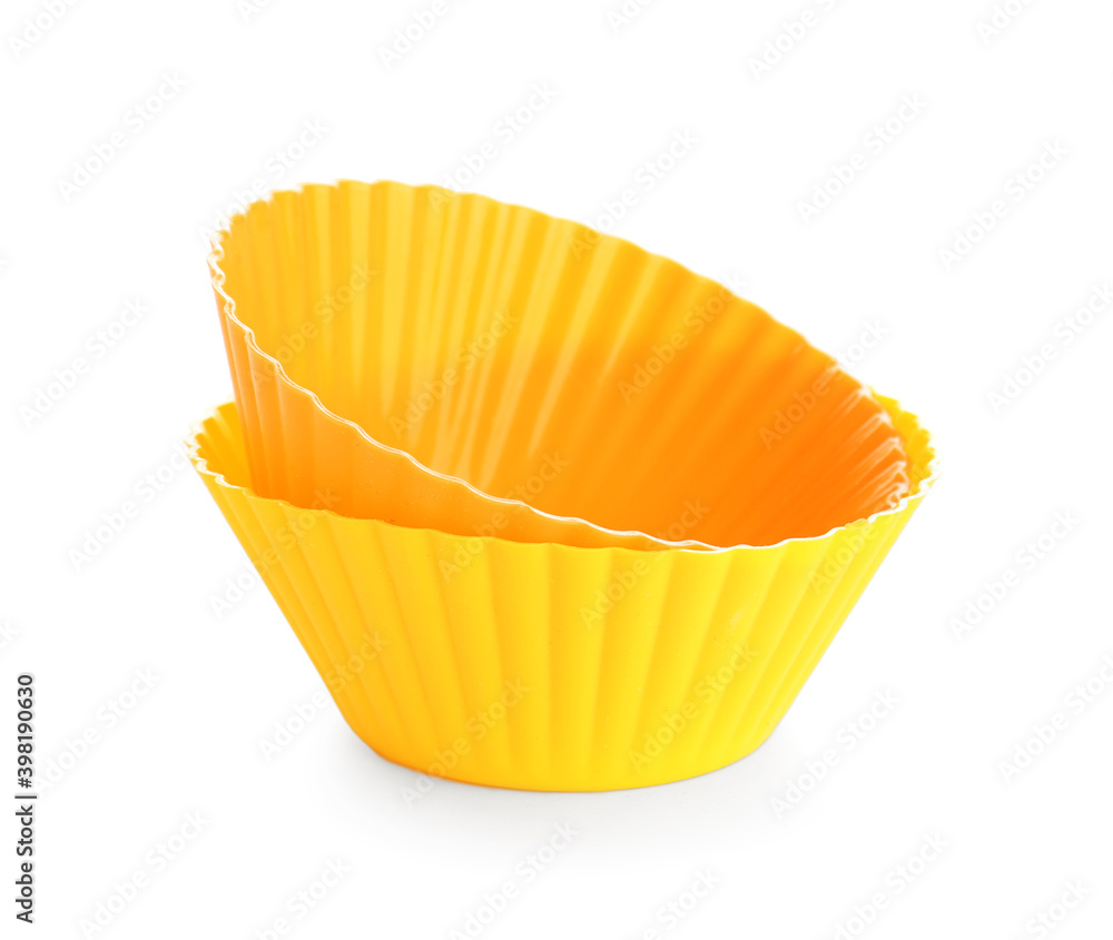 Baking forms for cupcakes on white background