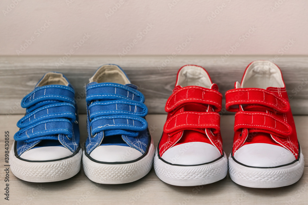 Childs shoes near light wall